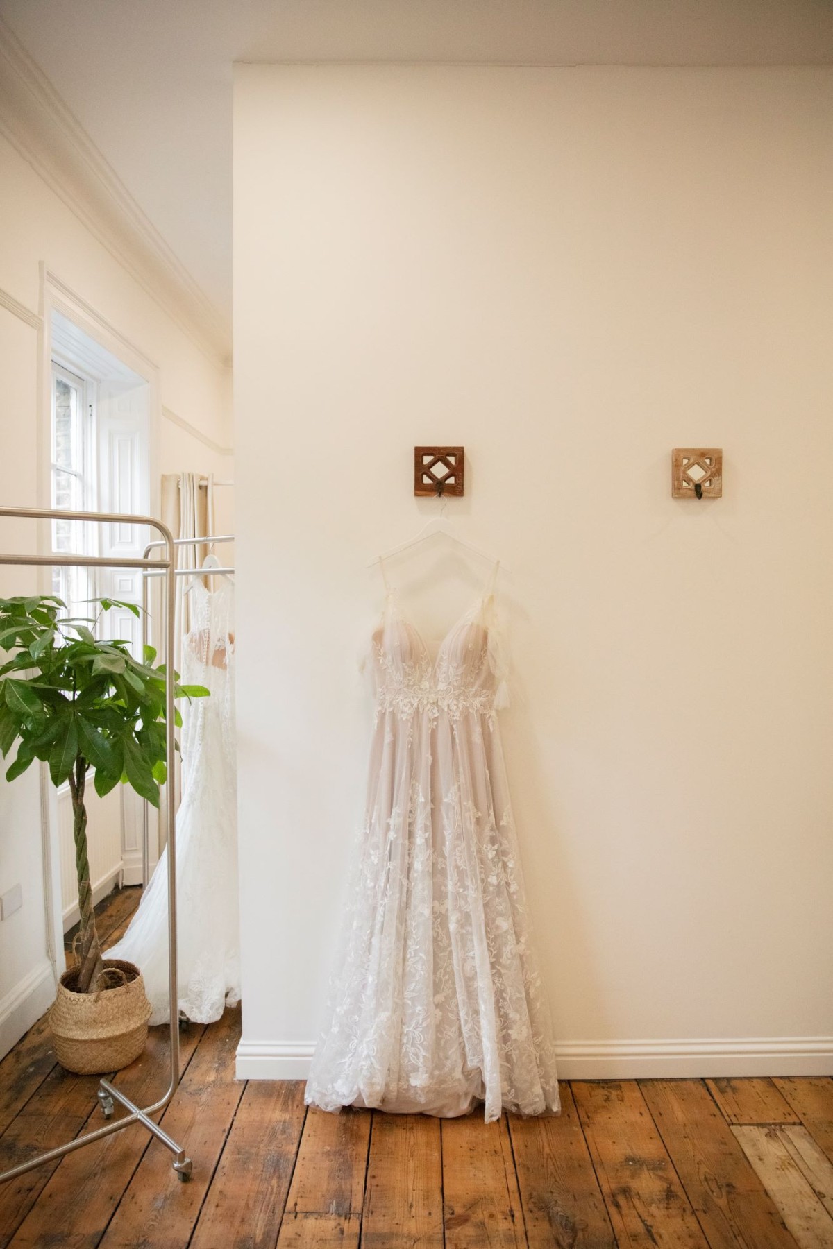 A dress hanging in the You Are Precious bridal townhouse